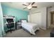 Bright bedroom featuring a ceiling fan, a desk, and a bed at 750 Trillium St, Lebanon, IN 46052