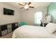 Bright bedroom featuring a ceiling fan, a desk, and a bed at 750 Trillium St, Lebanon, IN 46052