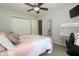 Bright bedroom with neutral walls, ceiling fan, and a closet for storage at 750 Trillium St, Lebanon, IN 46052