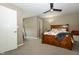 Bedroom featuring neutral walls, plush carpeting, and a wooden bed at 750 Trillium St, Lebanon, IN 46052