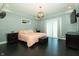 Comfortable bedroom with ensuite bathroom access, dark wood floors, and a ceiling fan at 750 Trillium St, Lebanon, IN 46052