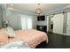 This is a cozy bedroom with a modern light fixture and a mounted TV, creating a relaxing atmosphere at 750 Trillium St, Lebanon, IN 46052
