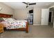 Bedroom featuring neutral walls, plush carpeting, and a ceiling fan at 750 Trillium St, Lebanon, IN 46052