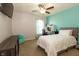 Bright bedroom featuring a ceiling fan, a desk, and a bed at 750 Trillium St, Lebanon, IN 46052