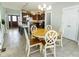 Open concept living area featuring the dining room and a view into the kitchen at 750 Trillium St, Lebanon, IN 46052