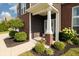 A close-up of the front porch with well-maintained landscaping at 750 Trillium St, Lebanon, IN 46052