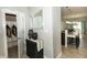 Hallway with closet space leading to the open kitchen and dining areas at 750 Trillium St, Lebanon, IN 46052