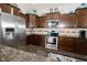 Gourmet kitchen with stainless steel appliances and granite countertops at 750 Trillium St, Lebanon, IN 46052