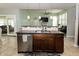 Island kitchen with stainless steel dishwasher, granite countertops, and pendant lighting at 750 Trillium St, Lebanon, IN 46052
