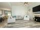 Spacious living room with a fireplace, ceiling fan, and hardwood flooring at 750 Trillium St, Lebanon, IN 46052