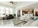 Open-concept living room showcases hardwood floors and a view of the kitchen at 750 Trillium St, Lebanon, IN 46052