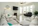 Bright living room with large sectional sofa, fireplace, and plenty of natural light at 750 Trillium St, Lebanon, IN 46052