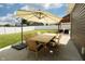 Backyard patio with an outdoor dining set and lush lawn at 750 Trillium St, Lebanon, IN 46052