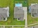 A bird's-eye view of this beautiful home featuring a pool, basketball court and a meticulously kept lawn at 8165 Oakley Ter, Zionsville, IN 46077