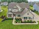 This two-story home has excellent curb appeal with a manicured lawn and charming front porch at 8165 Oakley Ter, Zionsville, IN 46077