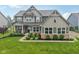 Charming two-story home featuring a beautifully landscaped yard and a welcoming front porch at 8165 Oakley Ter, Zionsville, IN 46077
