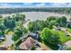 Stunning aerial shot of lakefront property with green trees surrounding area at 826 N Lanyard Dr, Cicero, IN 46034