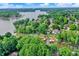 Expansive aerial view of a lakefront community with tree-lined streets and a serene lake at 826 N Lanyard Dr, Cicero, IN 46034