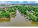 Breathtaking aerial view of a community with waterfront homes, lush greenery, and calm waters at 826 N Lanyard Dr, Cicero, IN 46034