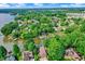 Scenic aerial view of a residential neighborhood nestled along a lake with lush greenery and private docks at 826 N Lanyard Dr, Cicero, IN 46034