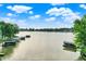 Scenic lake view of docks and waterfront properties under a sunny, blue sky at 826 N Lanyard Dr, Cicero, IN 46034