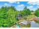 Scenic aerial view of a waterfront house, private dock, and lush greenery at 826 N Lanyard Dr, Cicero, IN 46034
