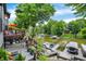 Stunning backyard featuring a deck, patio, lush landscaping, and a scenic view of the lake with boat docks at 826 N Lanyard Dr, Cicero, IN 46034