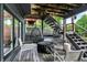 Backyard with outdoor seating, hanging chairs, and steps leading to the yard at 826 N Lanyard Dr, Cicero, IN 46034