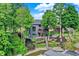 View of the tiered backyard with terraced retaining walls, stairs to the lake and docks below at 826 N Lanyard Dr, Cicero, IN 46034