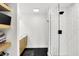 Stylish bathroom with a walk-in shower, hexagon tile floor, and floating shelves at 826 N Lanyard Dr, Cicero, IN 46034