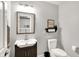 Well lit, updated bathroom with modern vanity, mirror, toilet, and tasteful decor at 826 N Lanyard Dr, Cicero, IN 46034