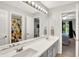 Bright bathroom with double vanity and view into secondary bedroom and water closet at 826 N Lanyard Dr, Cicero, IN 46034