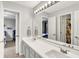 Bright bathroom with double vanity and view into secondary bedrooms at 826 N Lanyard Dr, Cicero, IN 46034