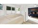 Bright bathroom showcases a soaking tub with tile surround and natural light at 826 N Lanyard Dr, Cicero, IN 46034