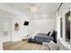 Inviting bedroom with wood flooring, recessed lighting, and large window at 826 N Lanyard Dr, Cicero, IN 46034