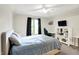 Bright bedroom with a ceiling fan, large window, and shelving unit at 826 N Lanyard Dr, Cicero, IN 46034
