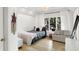 Cozy bedroom with natural light, shiplap walls, and minimalist decor at 826 N Lanyard Dr, Cicero, IN 46034