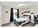 Nicely decorated bedroom with ceiling fan, natural light, and shelving for storage at 826 N Lanyard Dr, Cicero, IN 46034