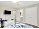 Well-lit bedroom features a ceiling fan and view of the ensuite bathroom and walk-in closet at 826 N Lanyard Dr, Cicero, IN 46034