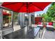 Cozy outdoor seating on this lovely deck with an umbrella table and view of the yard at 826 N Lanyard Dr, Cicero, IN 46034