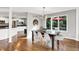 Dining room with hardwood floors, adjacent to kitchen and backyard with patio at 826 N Lanyard Dr, Cicero, IN 46034