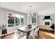 Bright dining room features an elegant chandelier, view of the deck and a glimpse into the living room at 826 N Lanyard Dr, Cicero, IN 46034