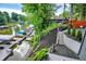 Well landscaped waterfront with boat dock, stairs, lush greenery, and lake views at 826 N Lanyard Dr, Cicero, IN 46034