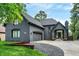 Beautiful two-story home with an attached garage, manicured lawn, and mature trees at 826 N Lanyard Dr, Cicero, IN 46034