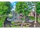 Rear exterior view of home with terraces, decks, and a landscaped yard at 826 N Lanyard Dr, Cicero, IN 46034