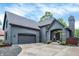 Beautiful home featuring a large driveway, arched entryway, and a two-car garage at 826 N Lanyard Dr, Cicero, IN 46034