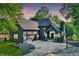 Beautiful, single-Gathering home with black brick and complementary roof with a three-car garage and basketball court at 826 N Lanyard Dr, Cicero, IN 46034