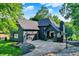 Beautiful, single-Gathering home with black brick and complementary roof with a three-car garage and basketball court at 826 N Lanyard Dr, Cicero, IN 46034