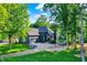 Inviting single-Gathering home features a well-maintained lawn, mature trees, and a circular driveway at 826 N Lanyard Dr, Cicero, IN 46034