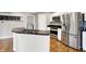 Bright kitchen features white cabinets, granite counters, and stainless steel appliances, and a breakfast nook at 826 N Lanyard Dr, Cicero, IN 46034
